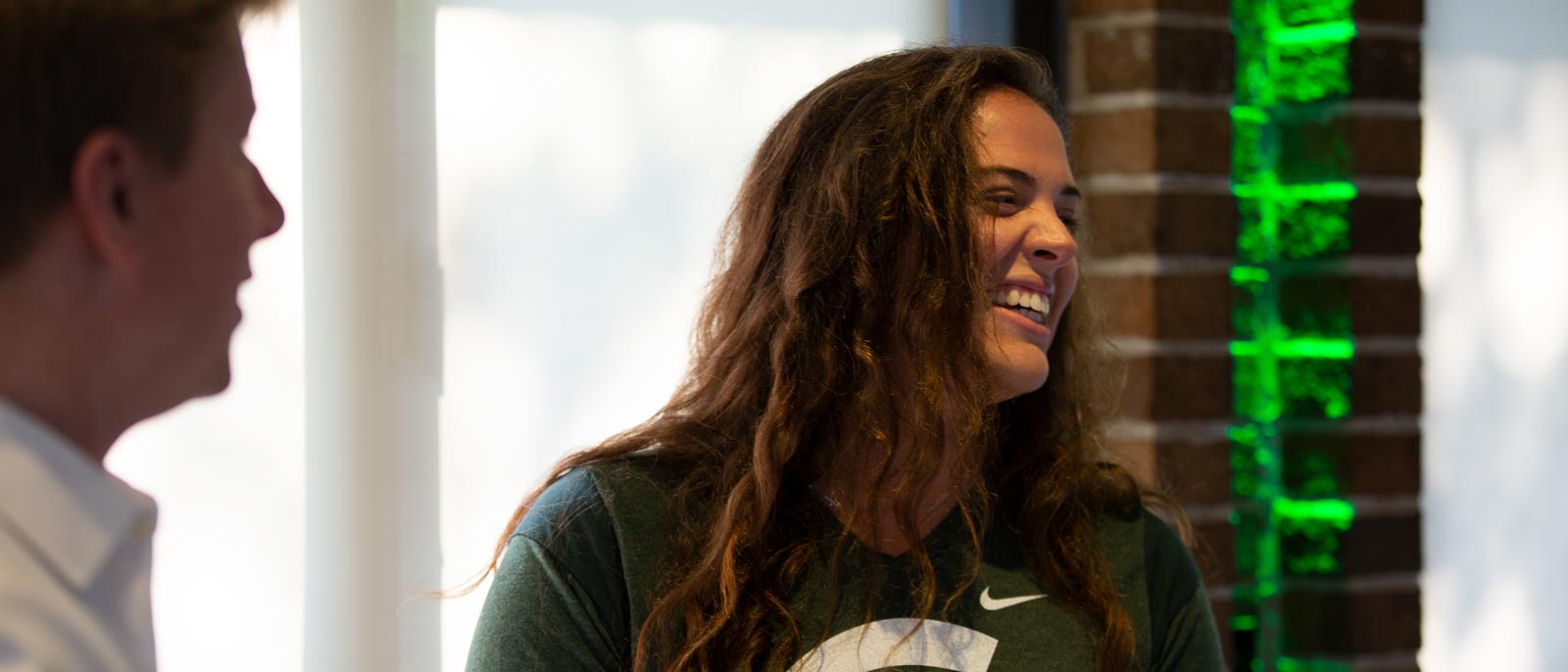 Michigan State Full-Time MBA student smiles while taking part in an Extreme Green event.