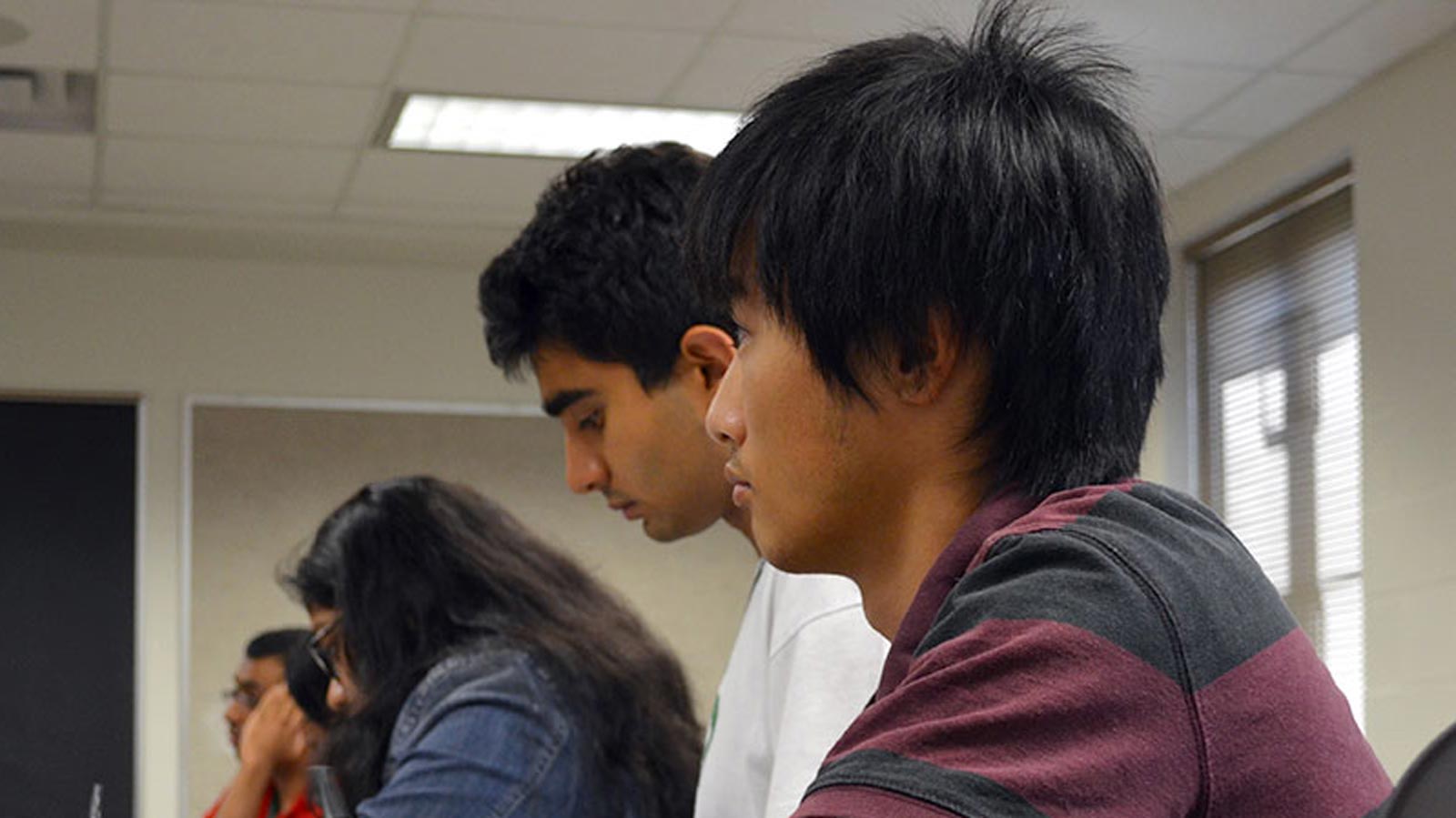 Students take notes while attending the Multicultural Business Student Success Academy.