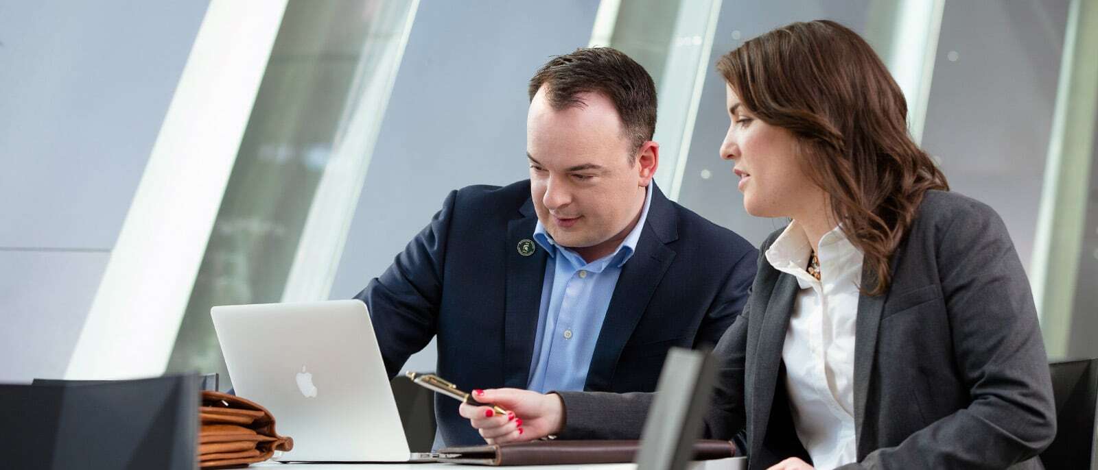 Michigan State University MBA Students working together at a table