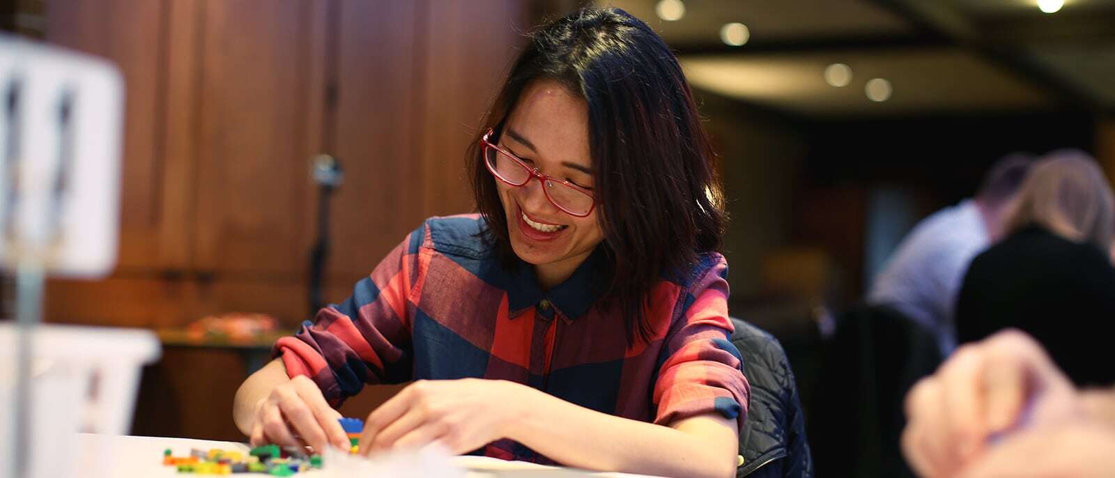 Full-Time MBA student assembling Legos.