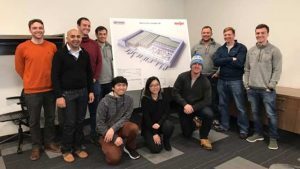 Group photo of Michigan State full-time MBA students in the Graduate Supply Chain Management Association, standing inside the Meijer distribution center.