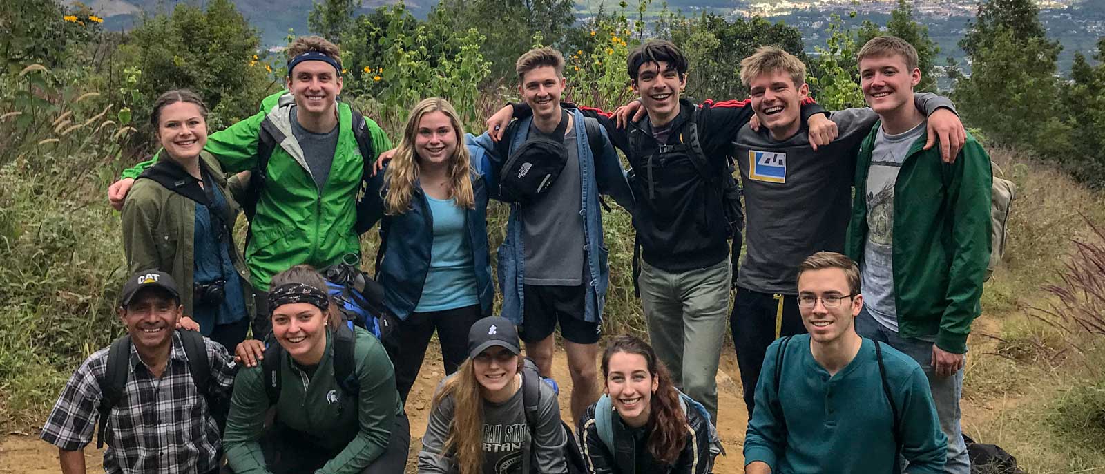 Group of Spartan Global Development Fund students pose for photo in hiking gear.
