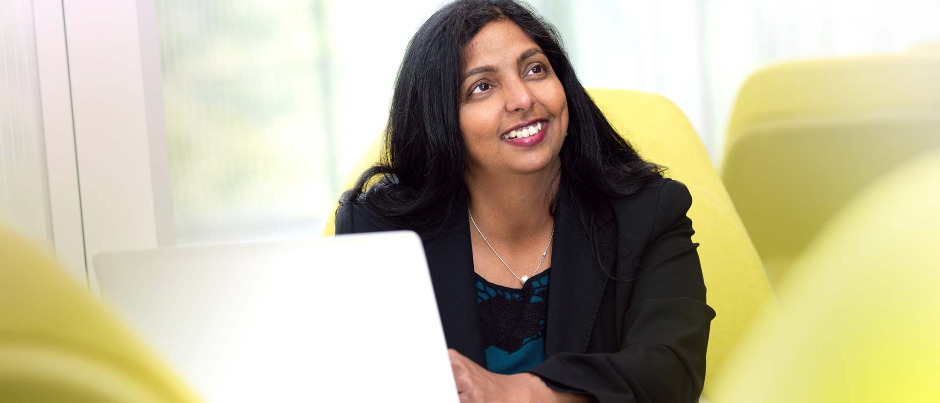 Associate Professor in Accounting and Information Systems Anjana Susarla poses in the Minskoff Pavilion at MSU