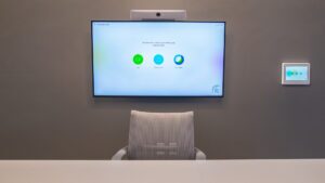 Zoom background set inside a team room inside the Broad College of Business