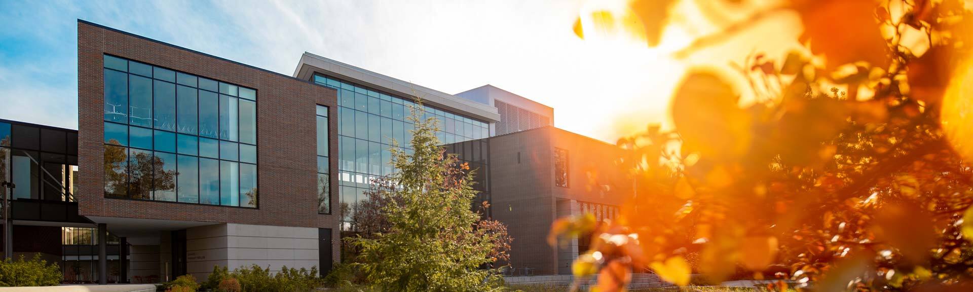Edward J. Minskoff Pavilion at sunset, as seen from the Red Cedar River