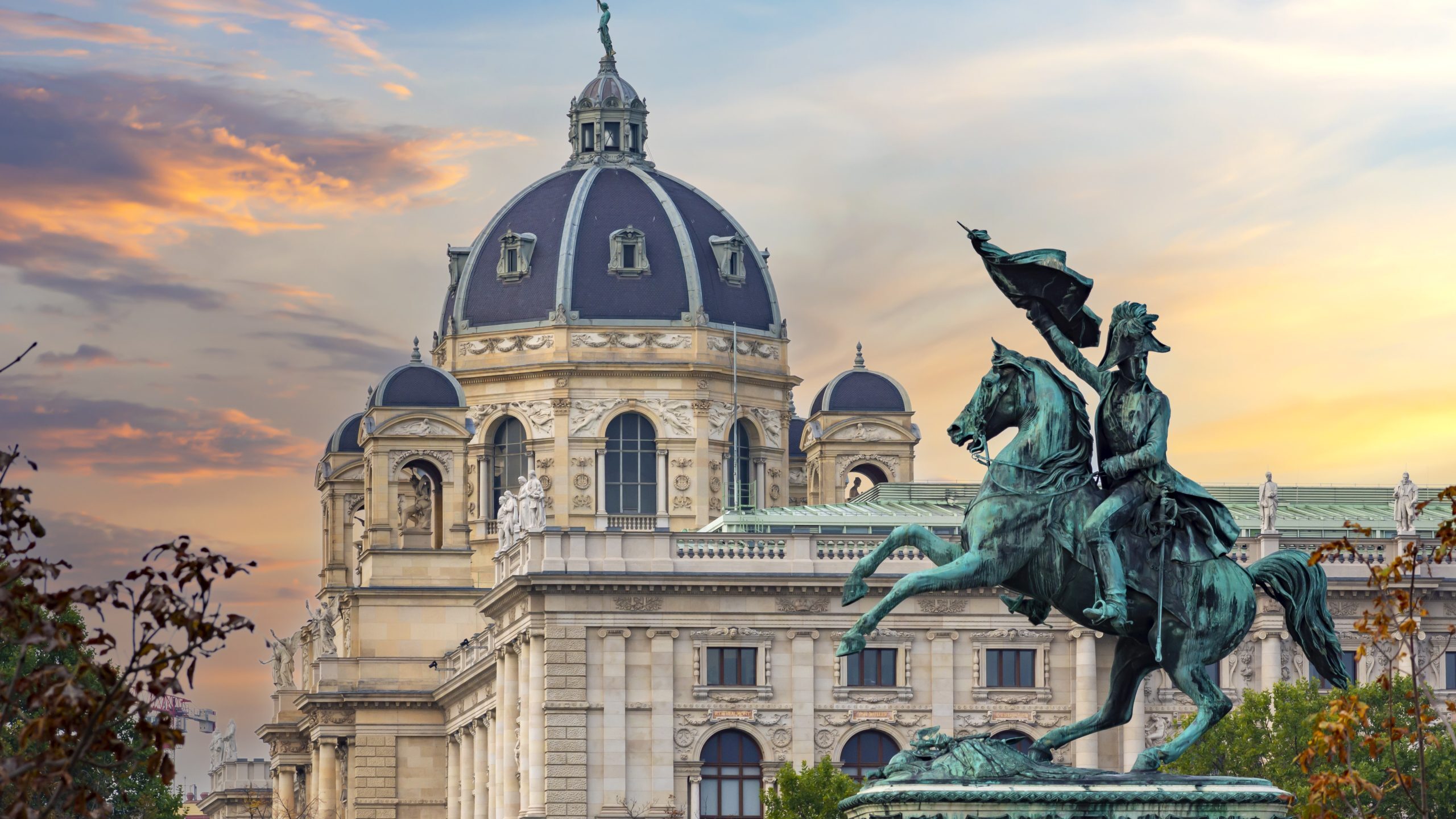 Chivalry statue in front of a castle