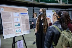 People reading a research poster