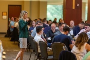 Cheri DeClercq addresses the Executive MBA Class of 2024 in the Henry Center.