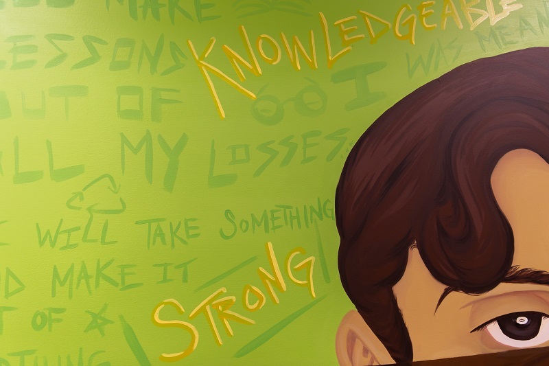 Close up of MBP mural with words 'knolwedgable' and 'strong' featured.