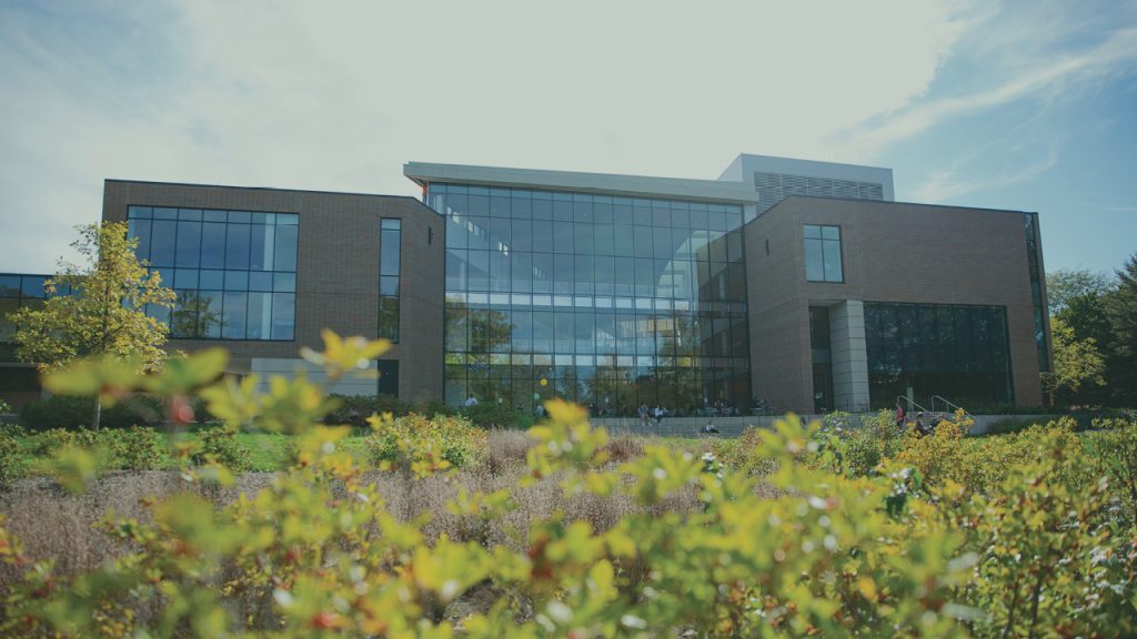 The back of the Michigan State University Eli Broad College of Business, facing the Red Cedar River.
