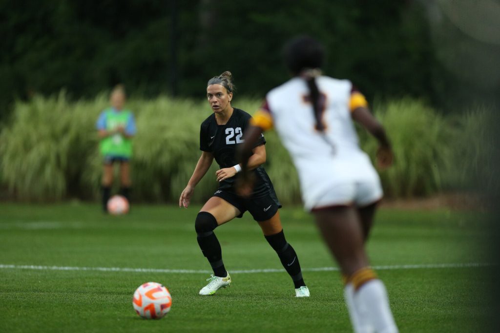 Abby Gardiner goes for the ball during a soccer match.