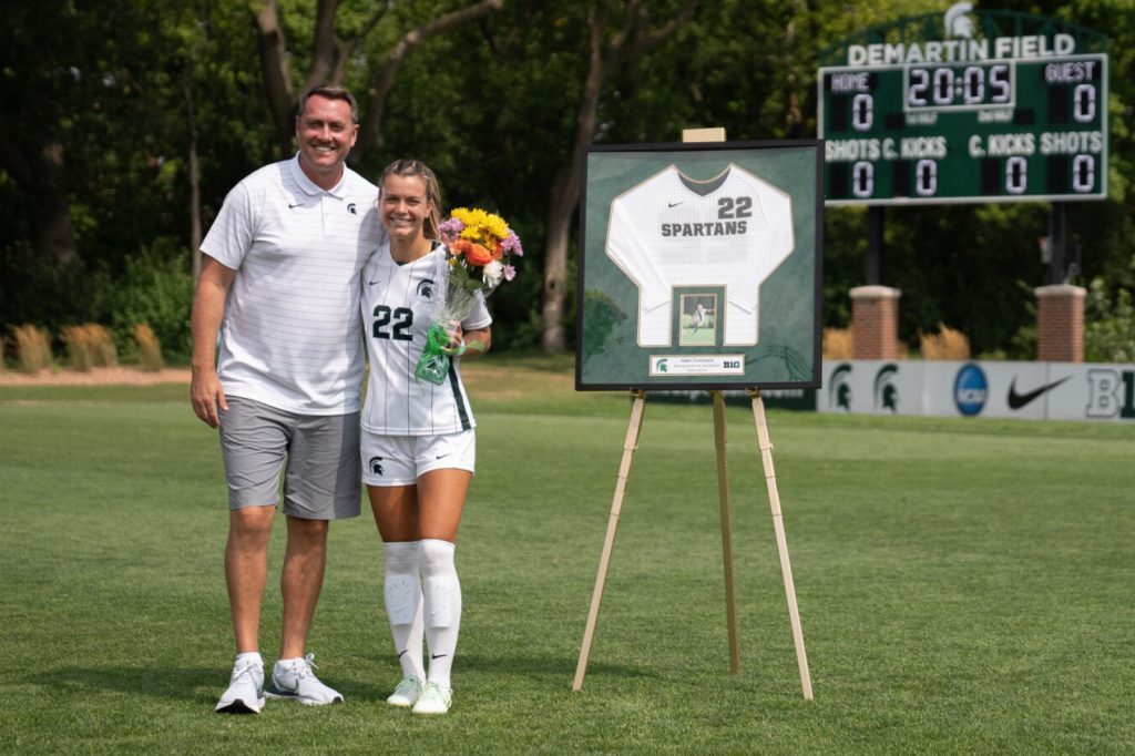 Head coach Jeff Hosler and scholar athlete Abby Gardiner on senior day