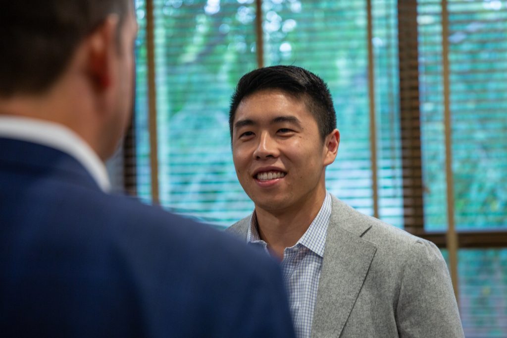 Financial markets and institutions members network at an FMI board meeting.