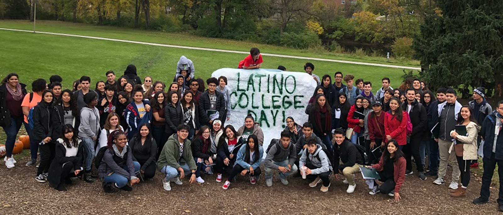 MBP Latino College students pose by the rock