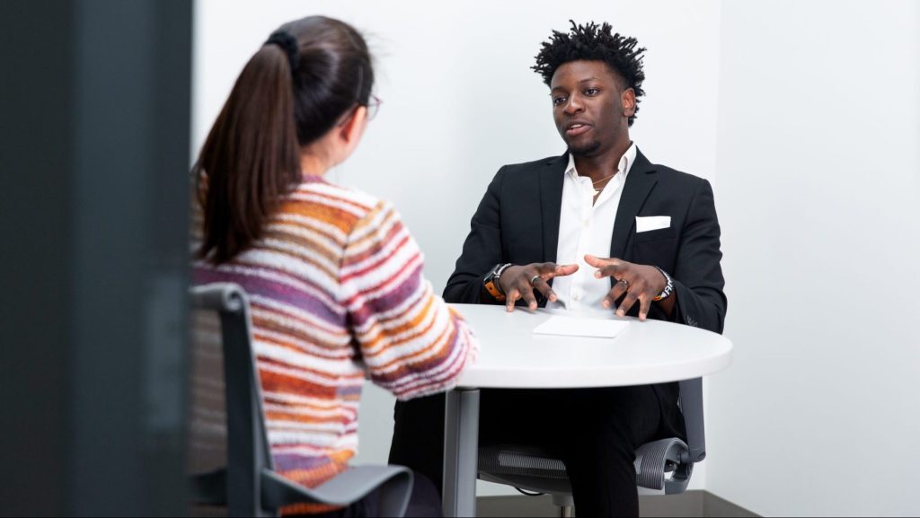 Two students having a discussion in the Broad College's Minskoff Pavilion.