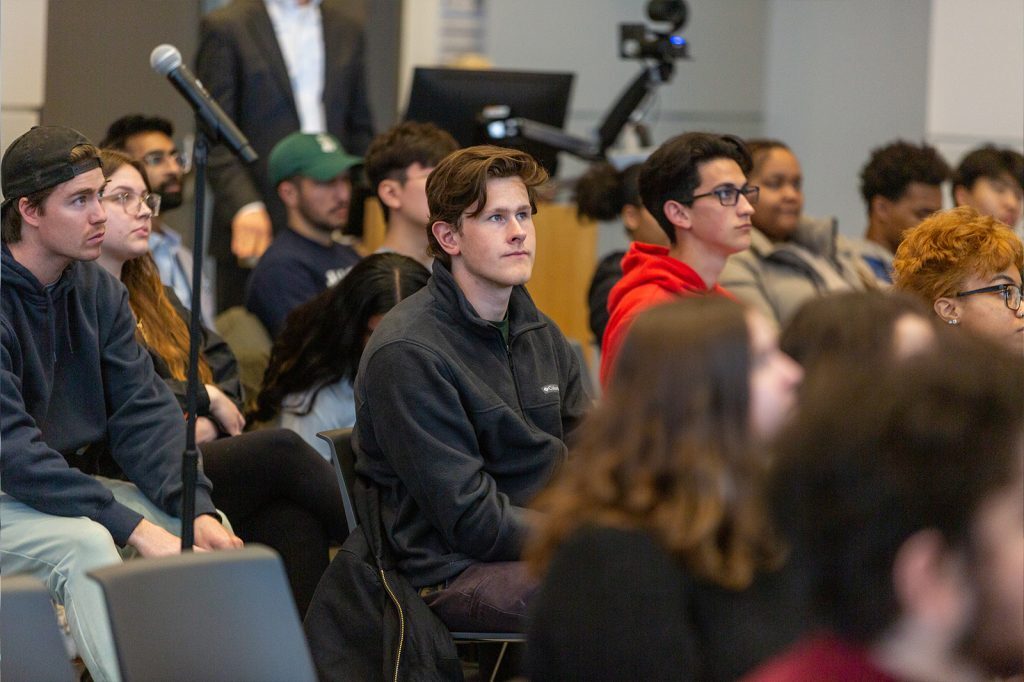 Student audience members listen to David Lanterman's presentation.
