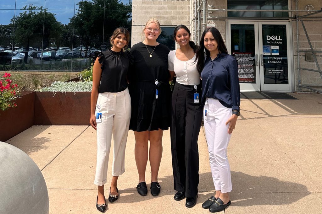 Niya Patel stands with other interns in front of a Dell building in Texas during her 2023 internship experience.