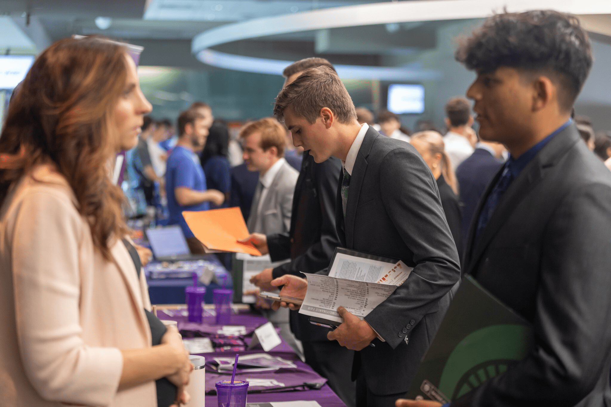 Students networking with hiring employers.