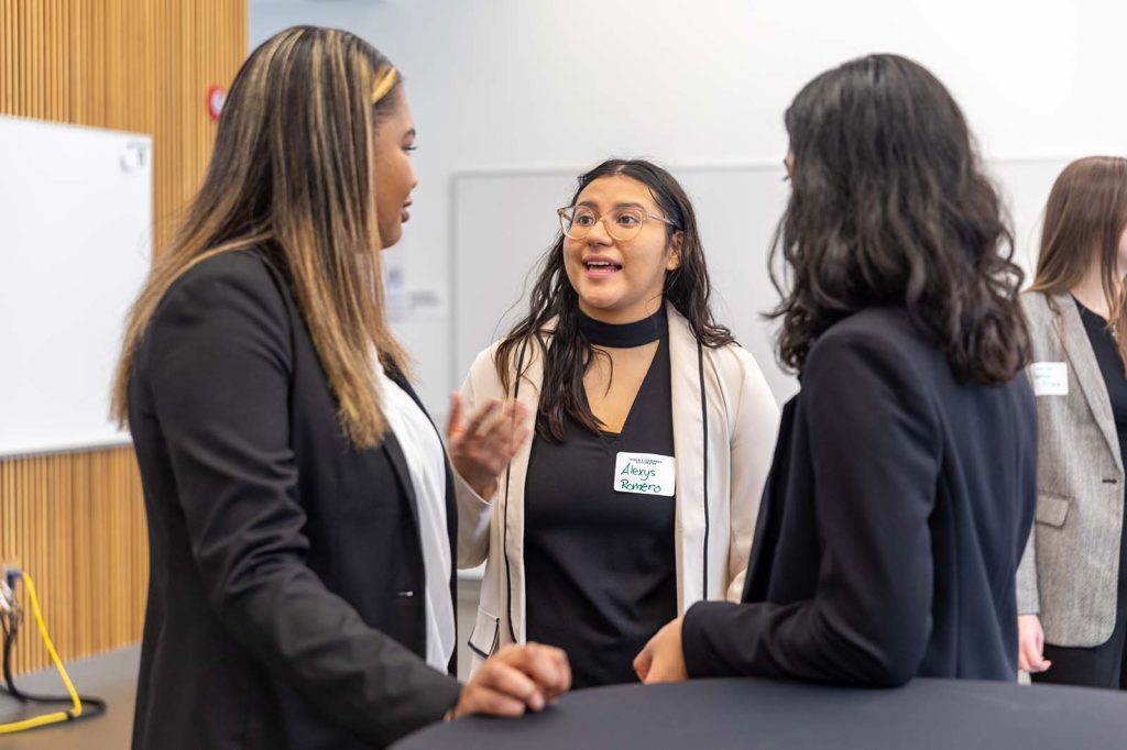 DWLA Scholars network with one another and talk at the launch event.