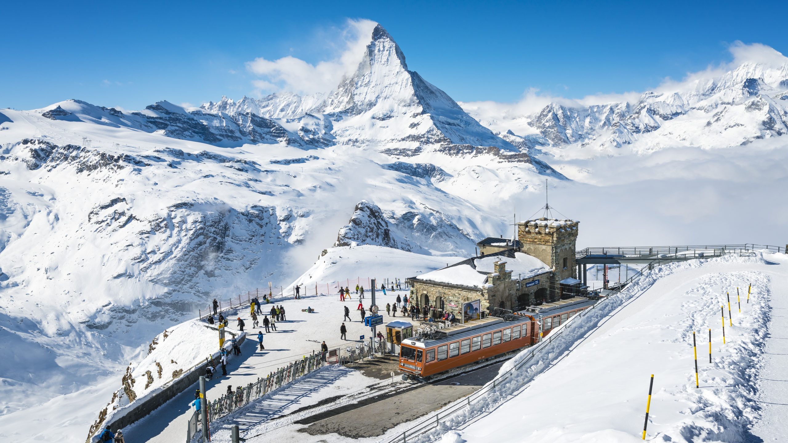 Snowy mountains and train station in Switzerland
