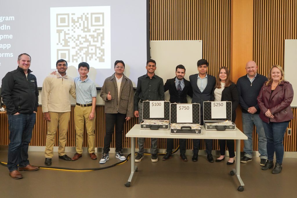 Student winners, judges and MSU employees take a photo at the Entrepreneurship Assocation msu student organization PitchMania! event.
