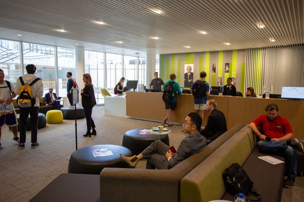 The Rusell Palmer Career Management Center main entrance busy with staff and students.