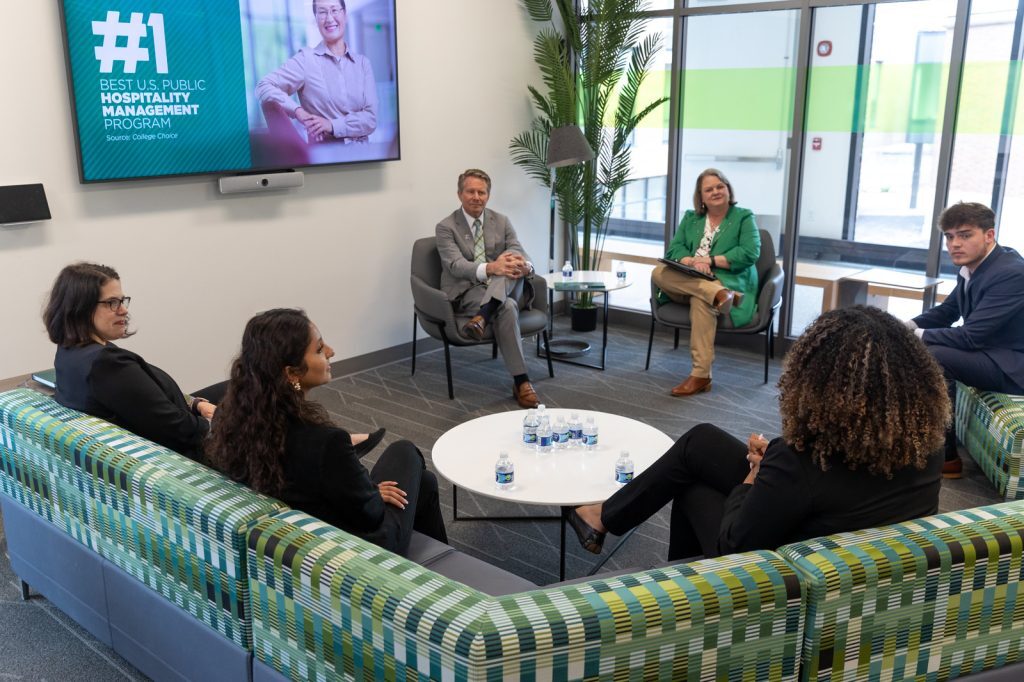 MSU President Kevin Guskiewicz and Judy sit with Broad students and staff int he Minskoff Pavilion.