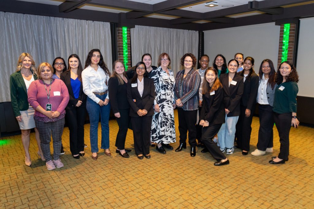 Group photo of event panelists and attendees