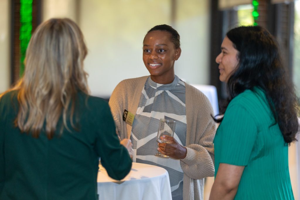 Event attendees networking at Advancing Women in Business event