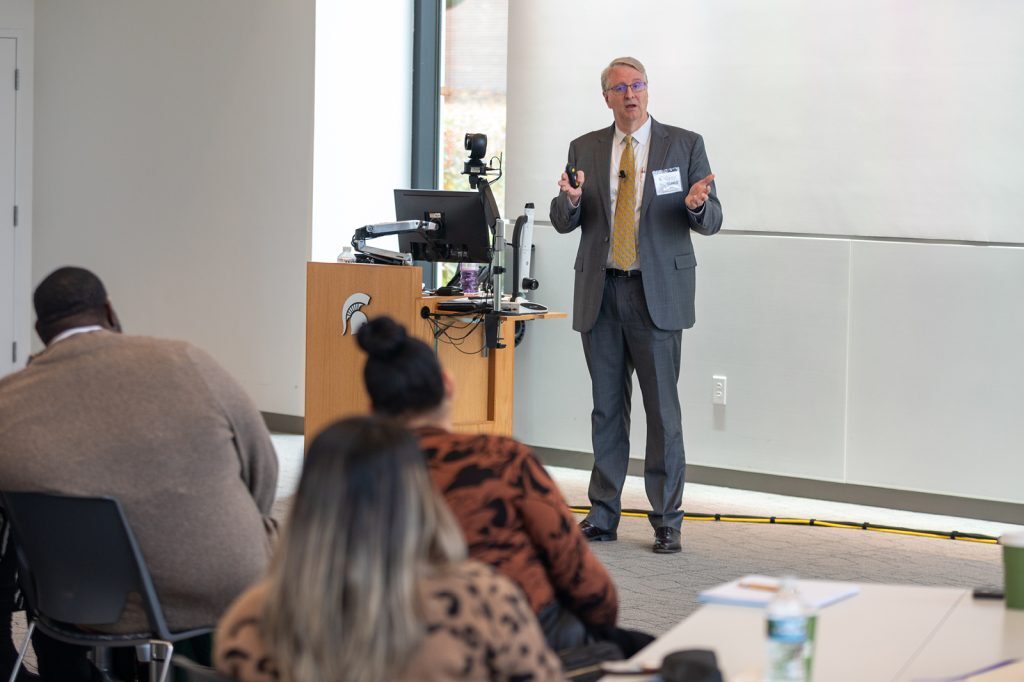 Glenn Hodges speaking to students