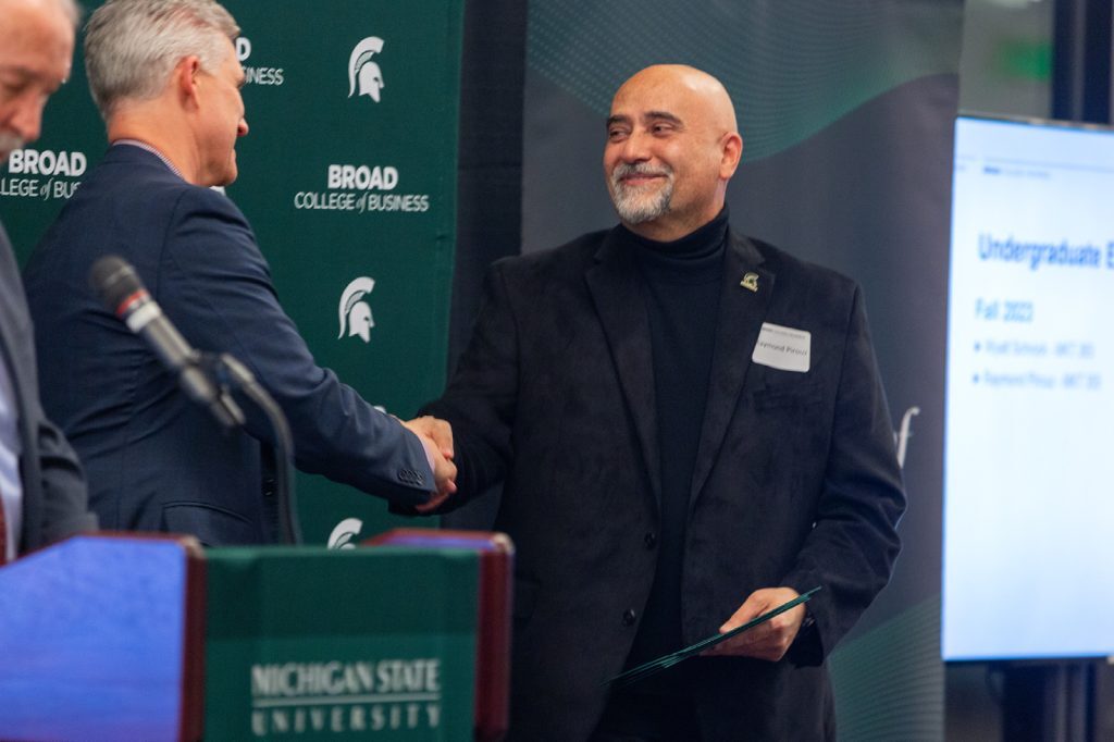 Awardee receiving award from David Souder