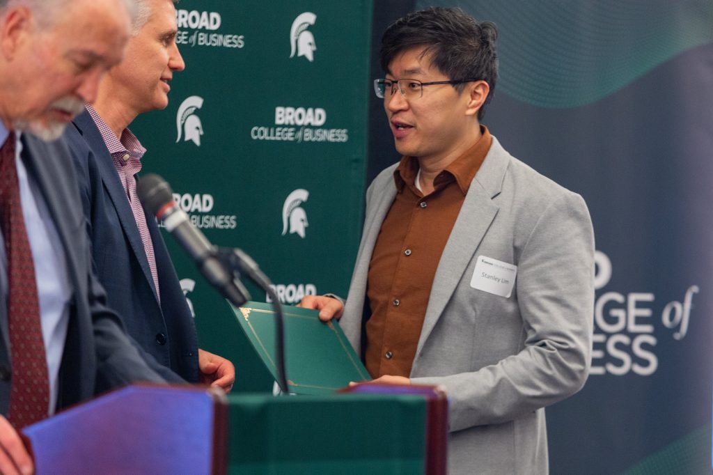 Awardee receiving award from David Souder