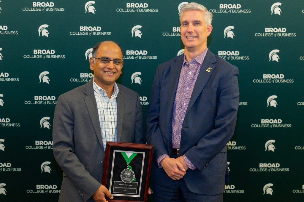 Sriram Narayanan standing with David Souder holding plaque
