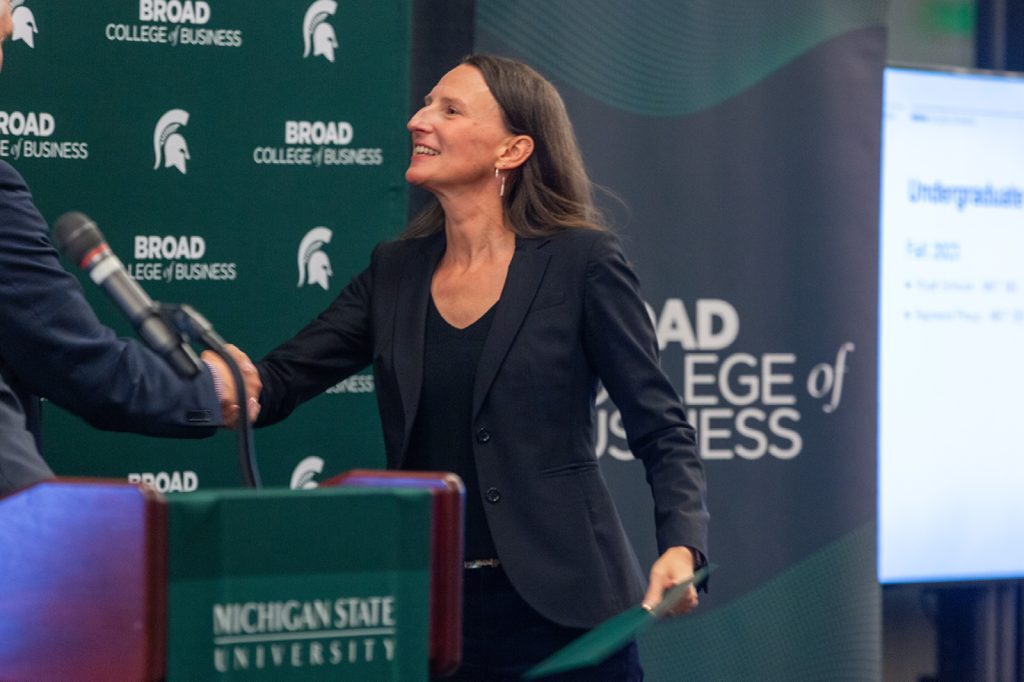 Awardee receiving award from David Souder