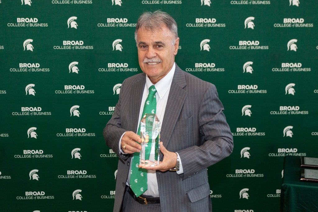 Man holding award