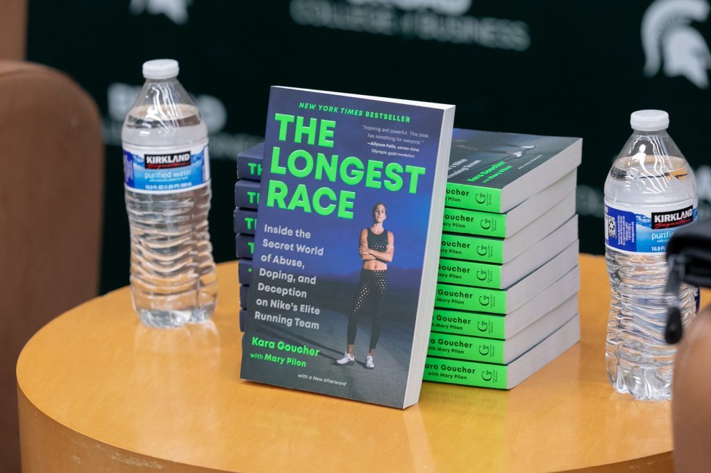 The Longest Race book on table with water bottles