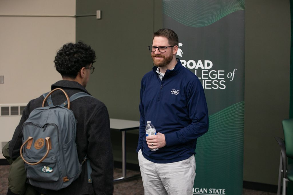Two people talking at Ethics Week events