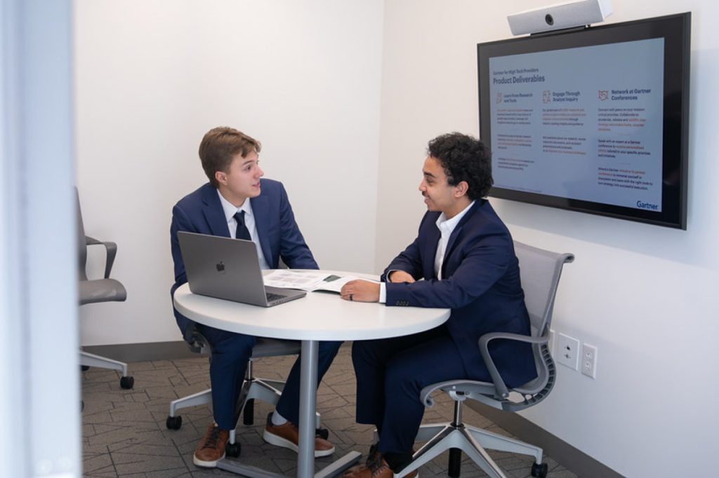 Two students having a seated discussion
