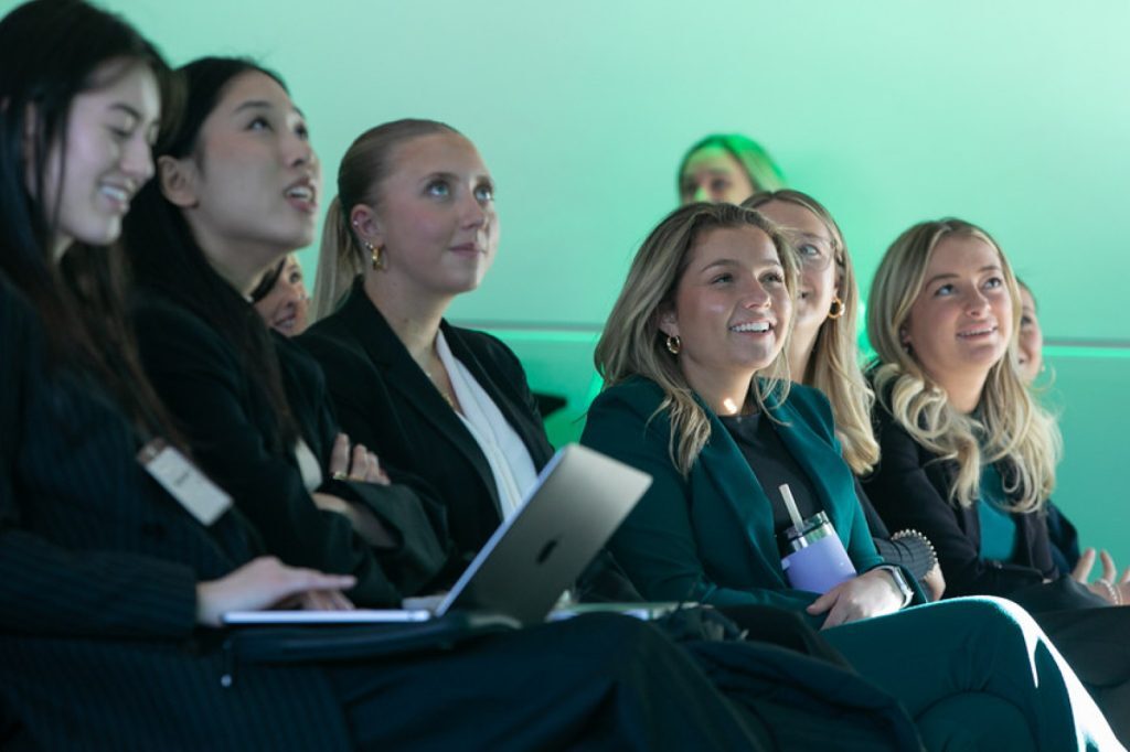 Group of students sitting and watching a presentation