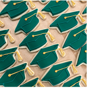 Sugar cookies shaped like graduation caps 