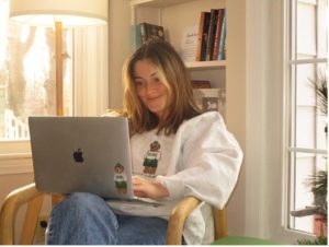 Student sitting and working on laptop 