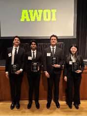 Group of students with plaques 