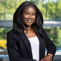 A professional headshot of Ozioma Michael