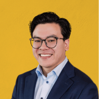 A professional headshot of David Ly