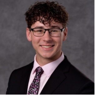 A professional headshot of Eric Kleinfelt