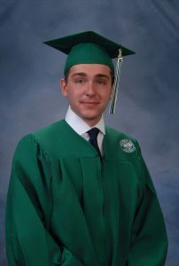 Student in graduation cap and gown 