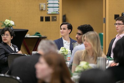 Students sitting at a table during the awards reception.
