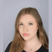 A professional headshot of Victoria Romanyshyn