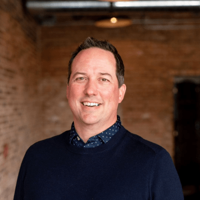 A professional headshot of Ian Olson