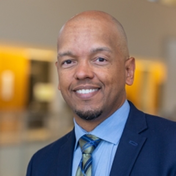 A professional headshot of Scot Wright